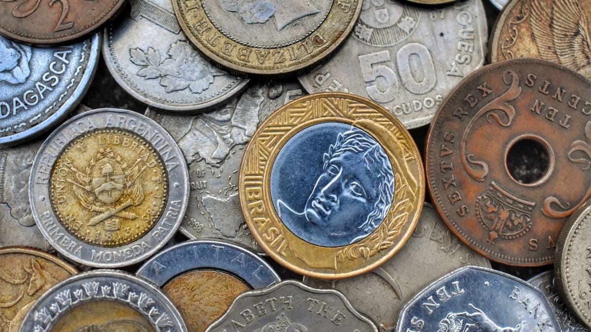 Top view of set of bright old metal coins with etchings and inscriptions with numbers