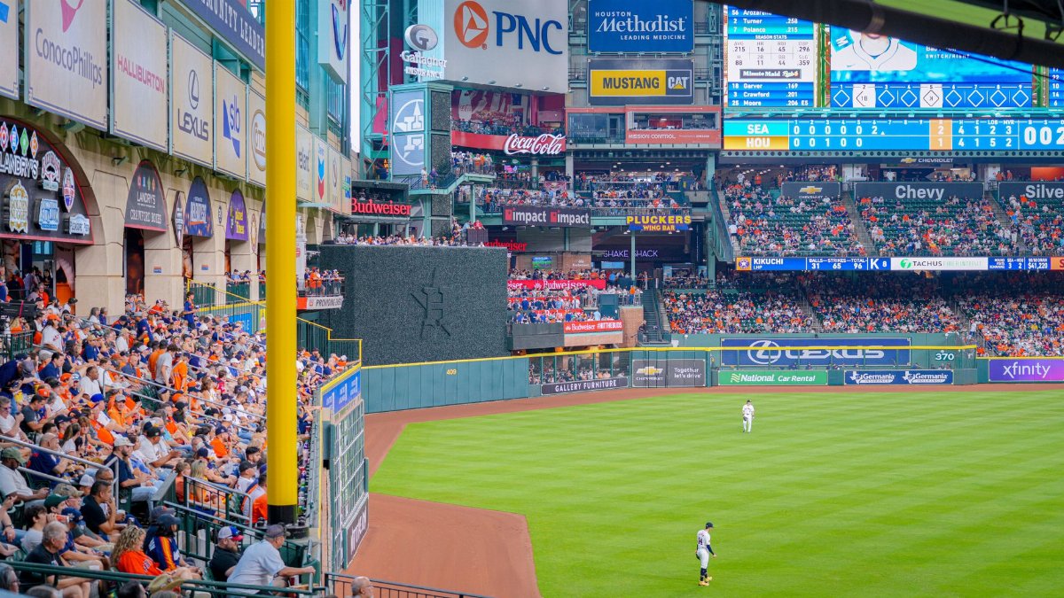 Vibrant baseball game scene with a full stadium, cheering crowd, and bright advertisements.