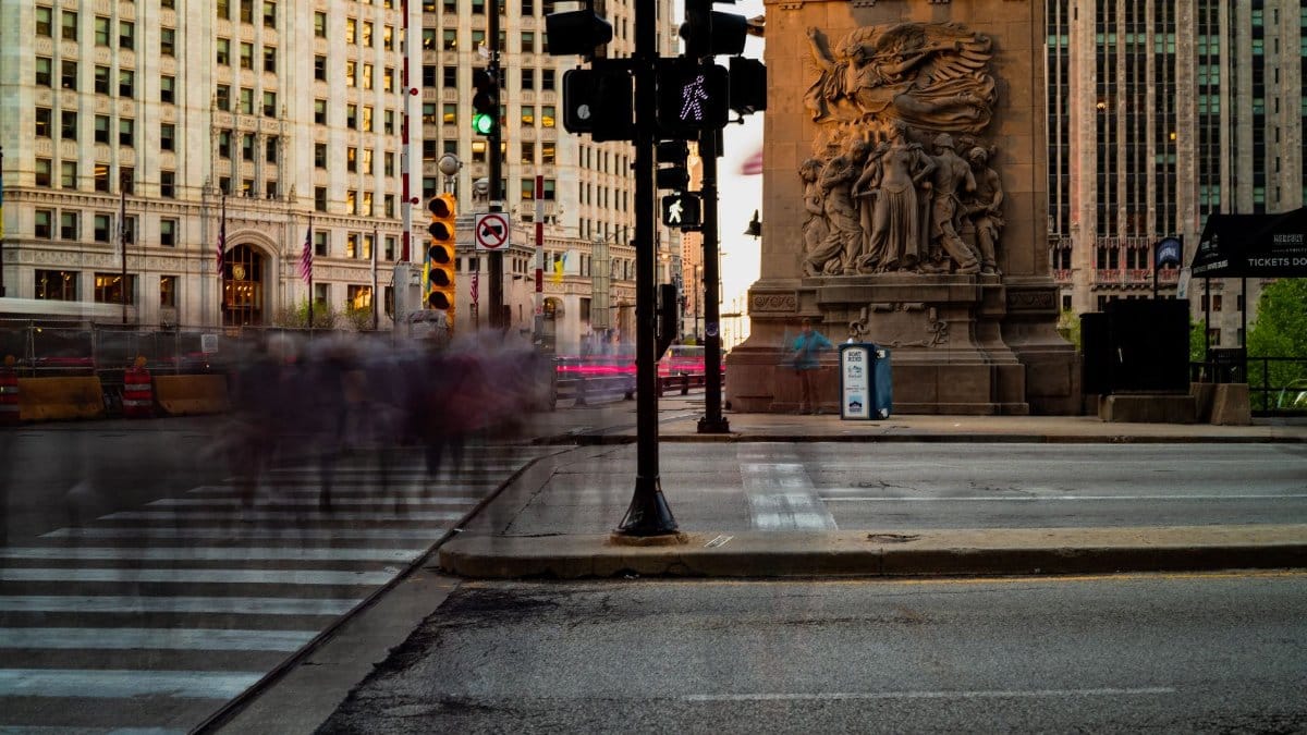 Long exposure shot of a bustling Chicago street with architectural details.