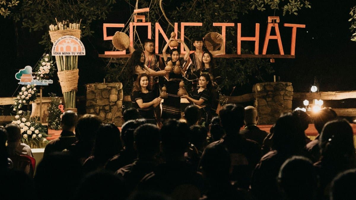 People gather for an evening cultural performance with traditional music and dance.