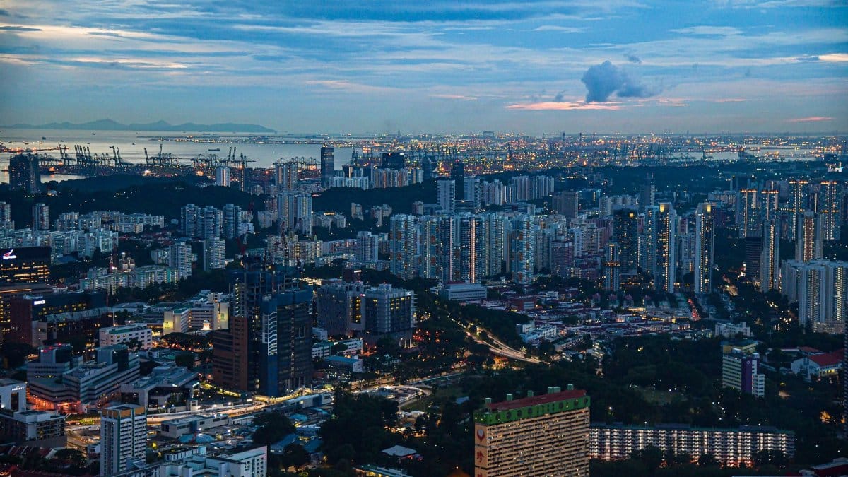 Skyline of Singapore at dusk showcasing urban buildings and scenic city lights.