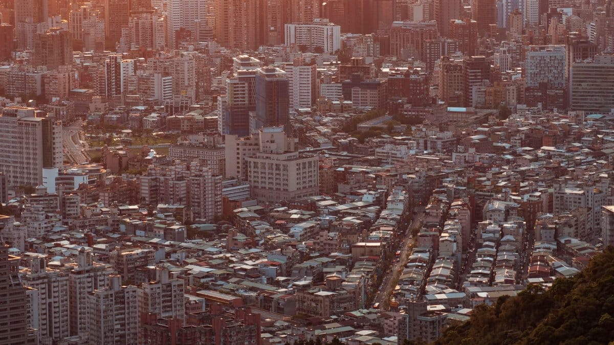 Captivating aerial cityscape view capturing urban architecture at sunset, highlighting vibrant city life.