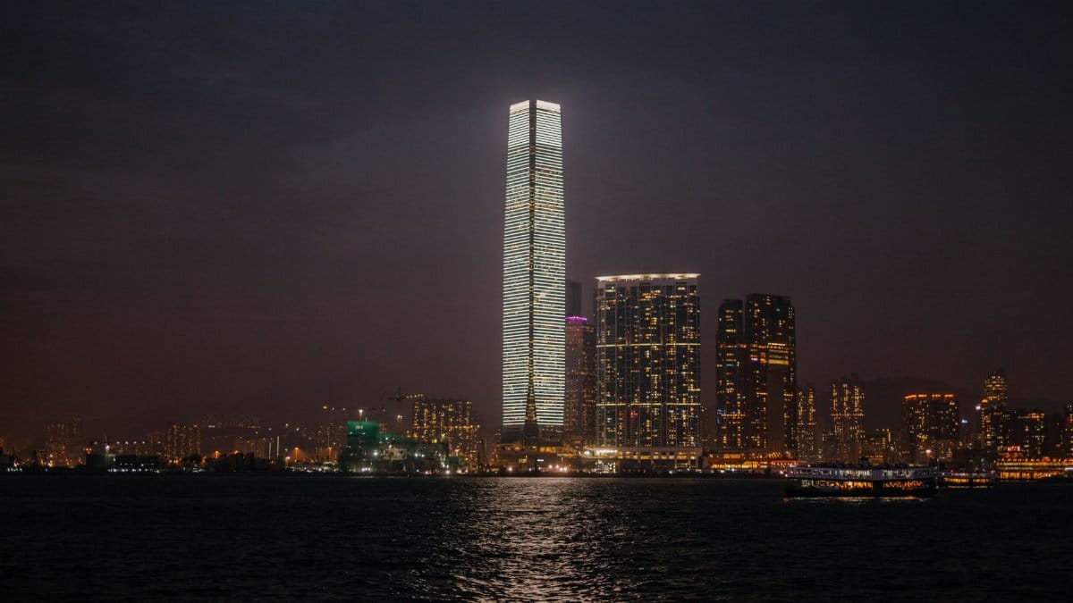 Intriguing night scene of Hong Kong's International Commerce Centre and skyline.