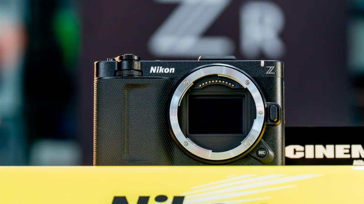 Detailed view of a mirrorless camera body without a lens, showcasing its design and features.
