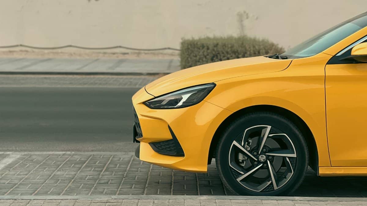 Close-up of a yellow sports car parked on a street in Dubai, United Arab Emirates.