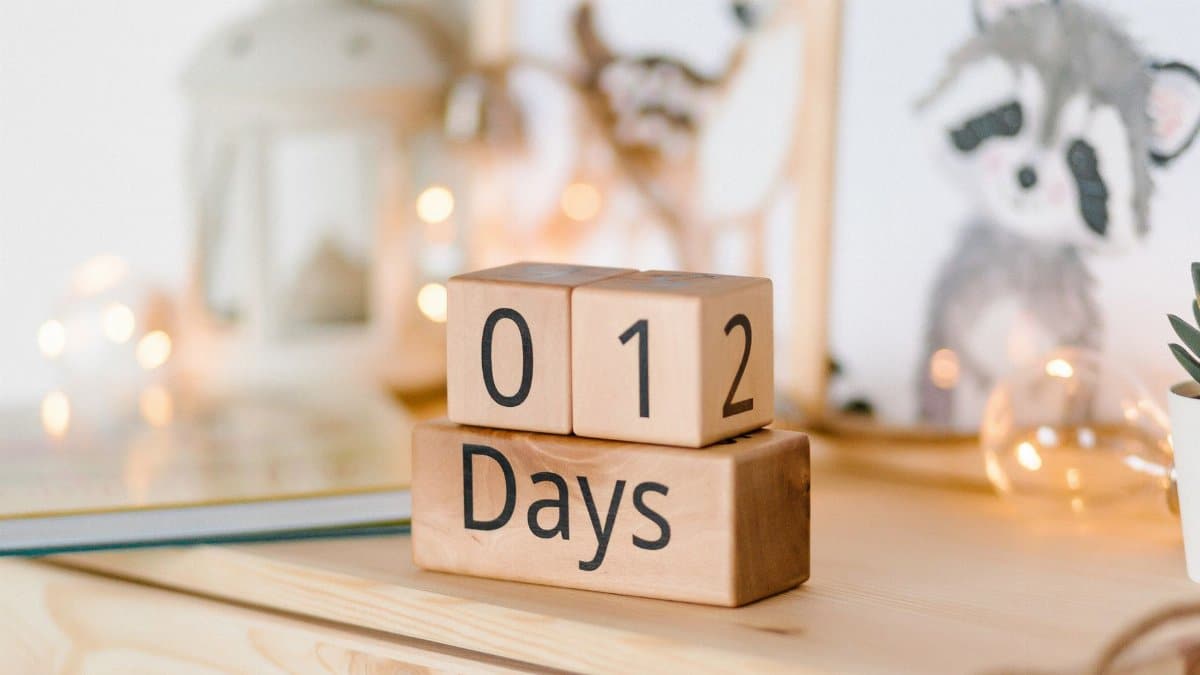 Cozy setting with wooden countdown blocks displaying '012 Days', perfect for event planning.
