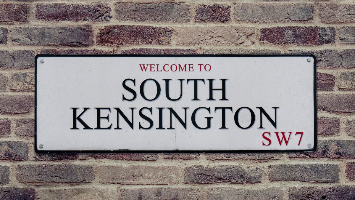 Street sign for South Kensington, London, UK, showcasing local charm.