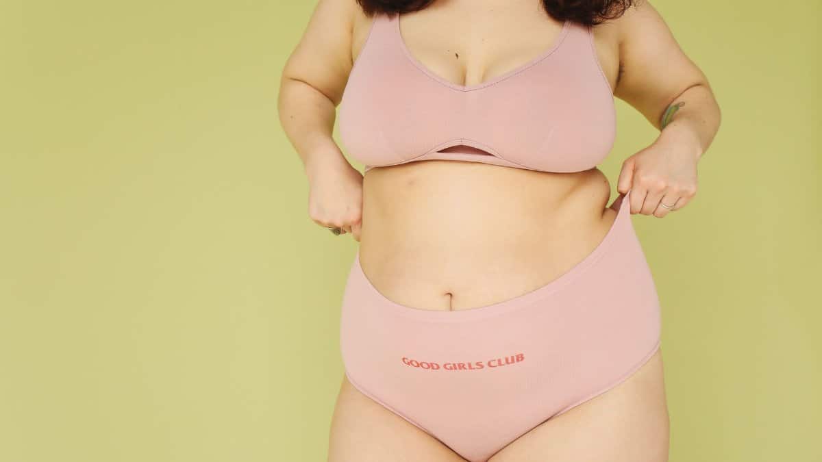 Embrace body positivity with this plus size model in a neutral background studio shoot.