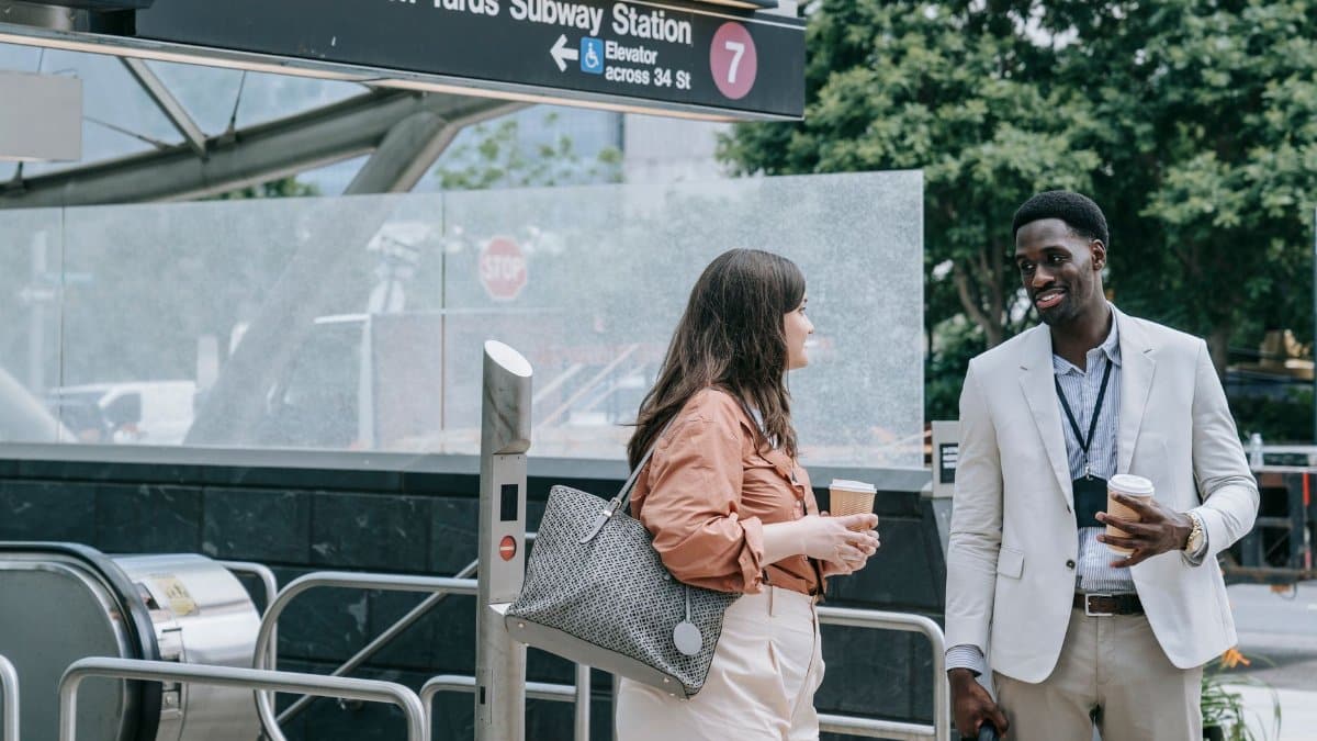 Two professionals having a chat at 4 Street-Hudson Yards Subway Station, NYC.