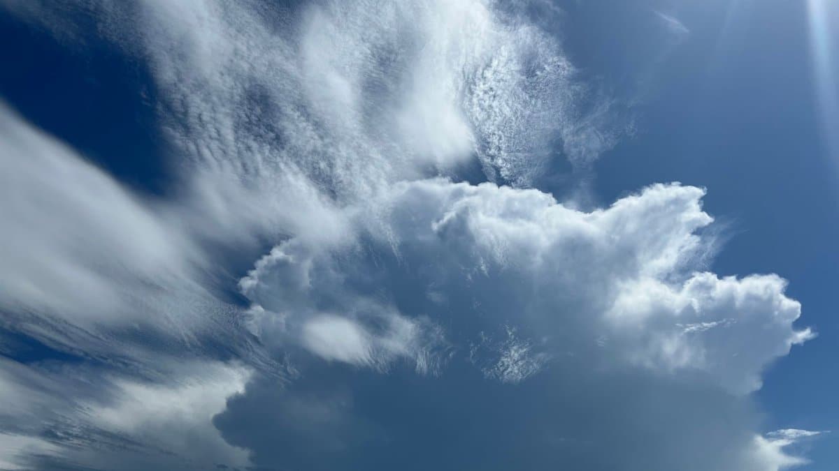 Stunning view of a cumulonimbus cloud formation under a bright summer sky.