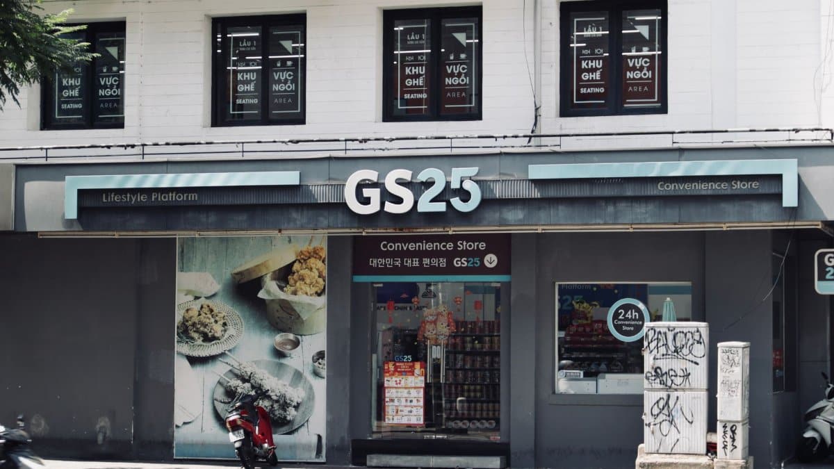 Street view of GS25 convenience store entrance with urban surroundings.