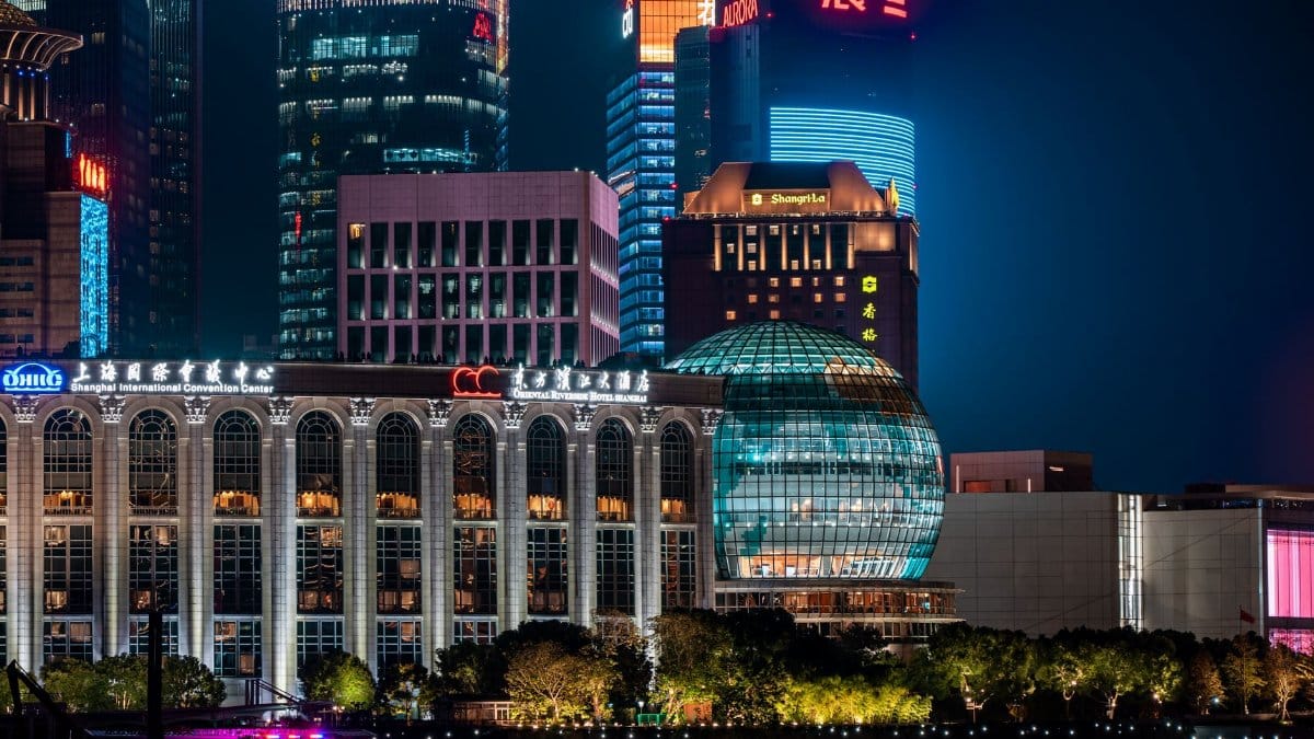 Stunning nighttime view of Shanghai's modern skyline with illuminated skyscrapers.