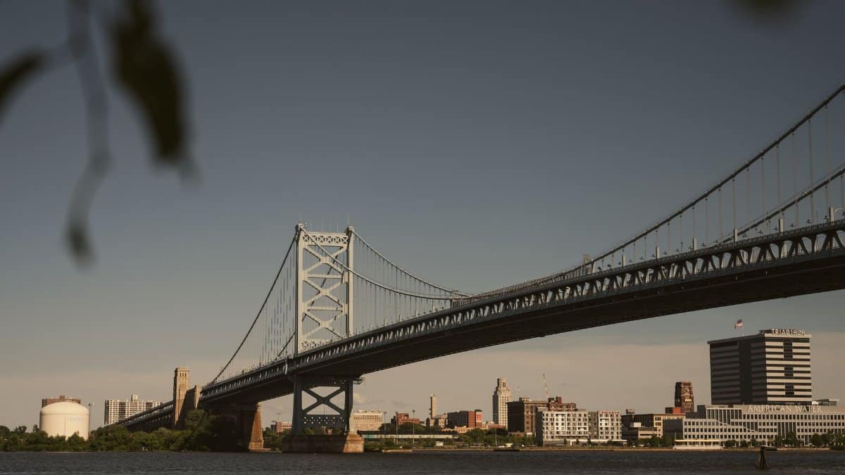 Scenic view of the Ben Franklin Bridge spanning the Delaware River with Philadelphia skyline in the background.