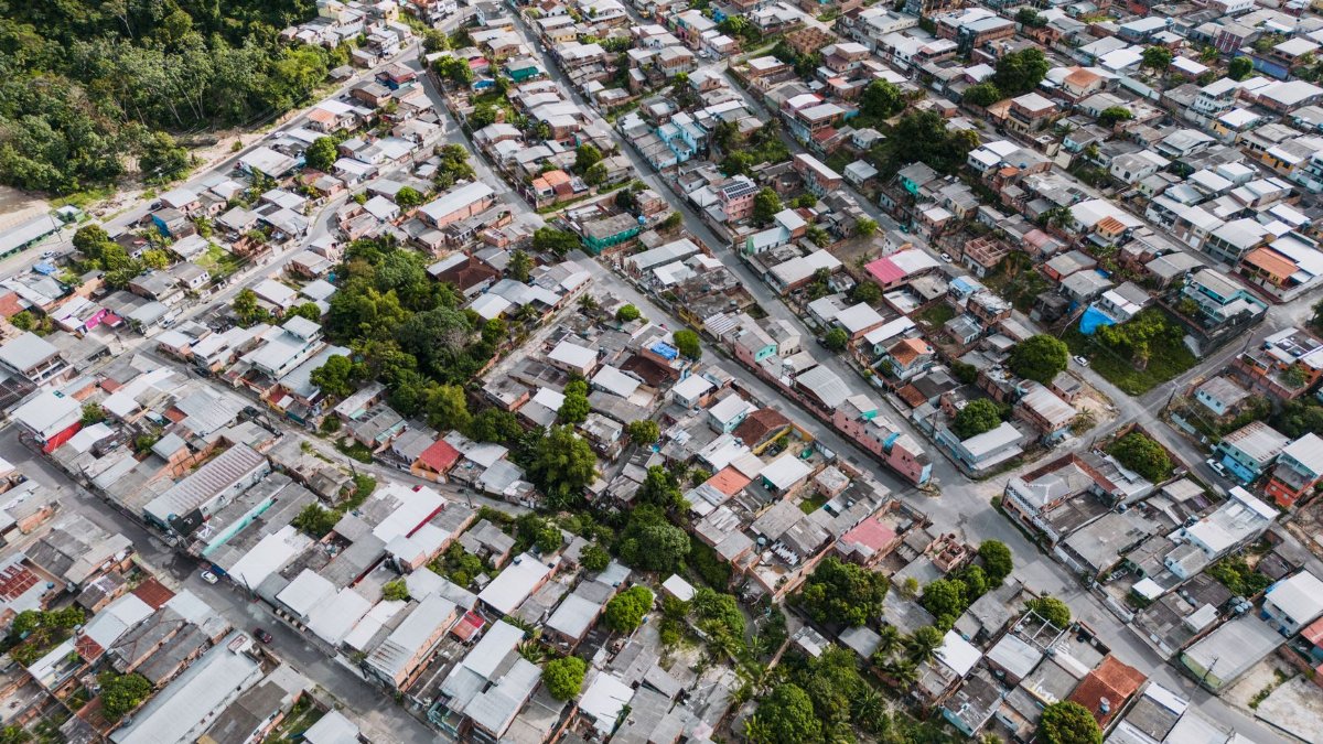 Aerial view of residential housing in São José Operário, Brazil. Urban landscape with greenery.