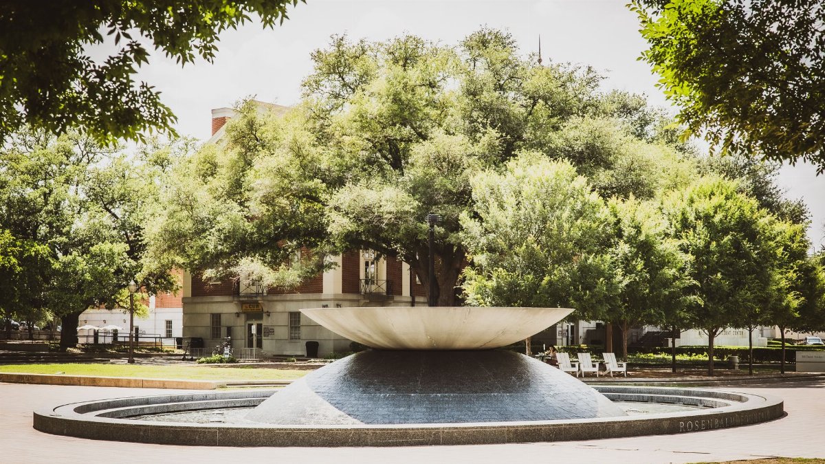 Scenic view of Rosenbalm Fountain surrounded by trees on a sunny day at Baylor University campus, Waco, Texas.