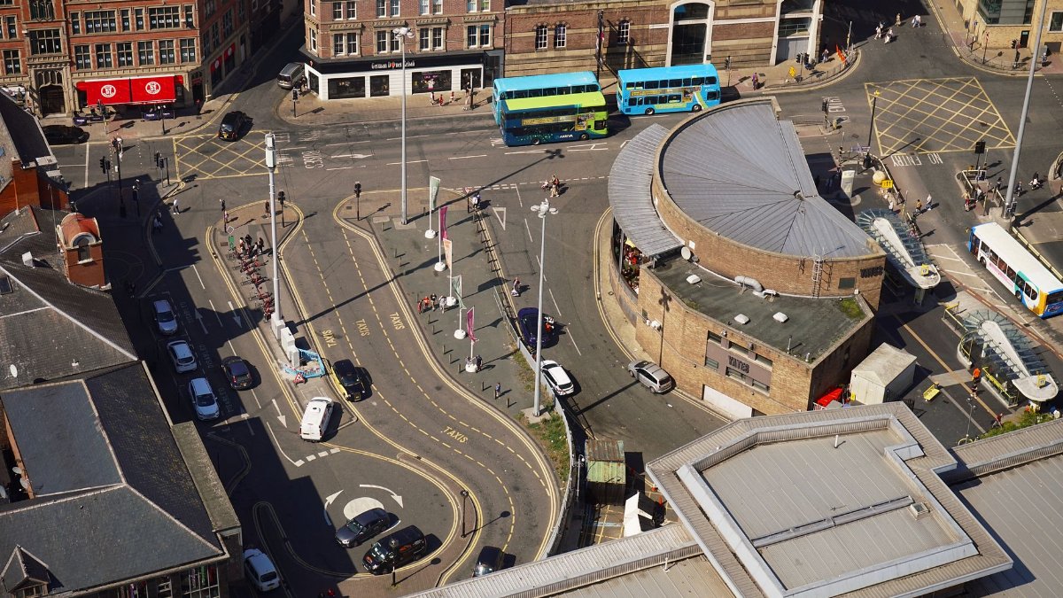 Explore the bustling streets of Liverpool from above, showcasing the dynamic urban landscape.
