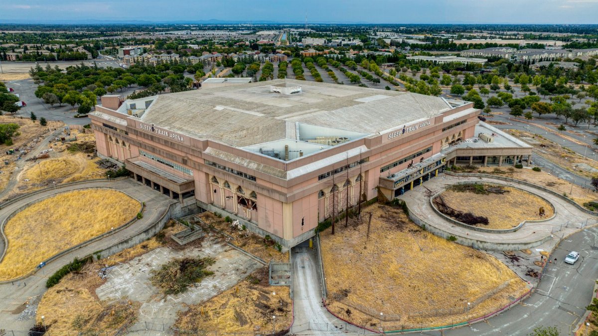 Aerial shot of the historic Sleep Train Arena and surrounding landscape in Sacramento, California.