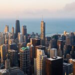 Stunning aerial view of the Chicago skyline with Lake Michigan in the background during sunset.