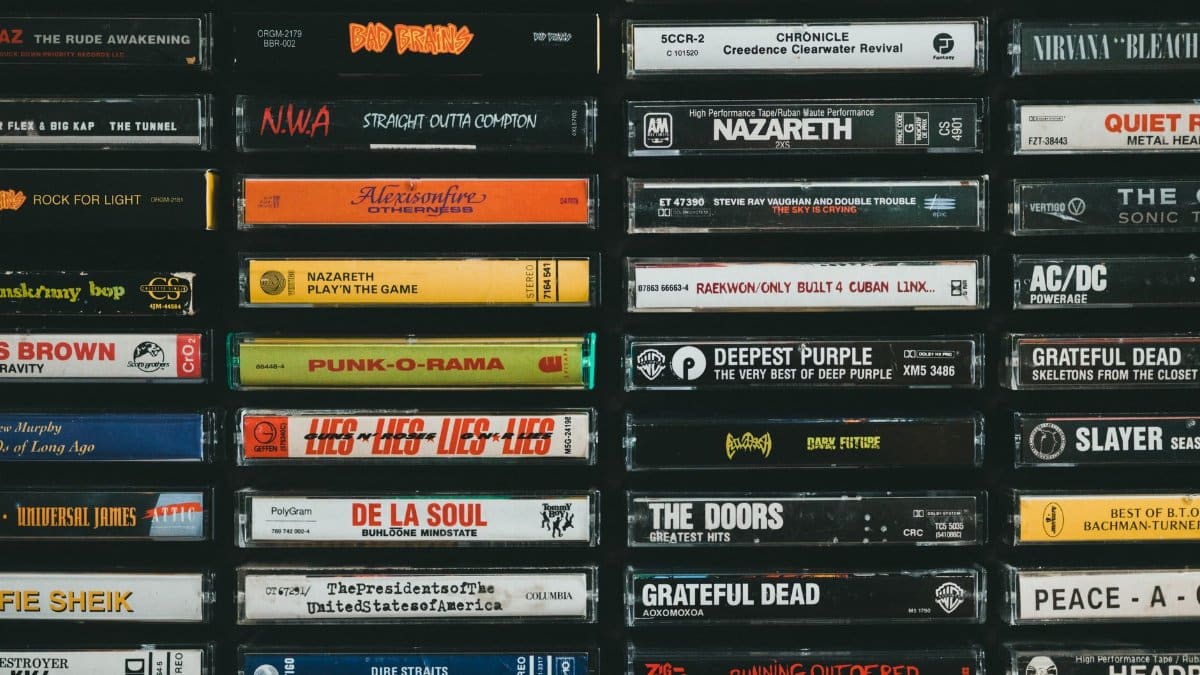 A nostalgic display of vintage cassette tapes featuring iconic bands and albums from the past.