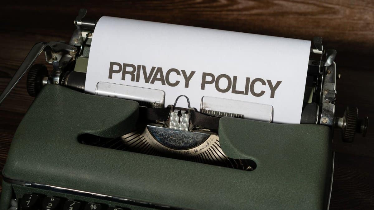 Close-up of a vintage typewriter with a sheet titled Privacy Policy.