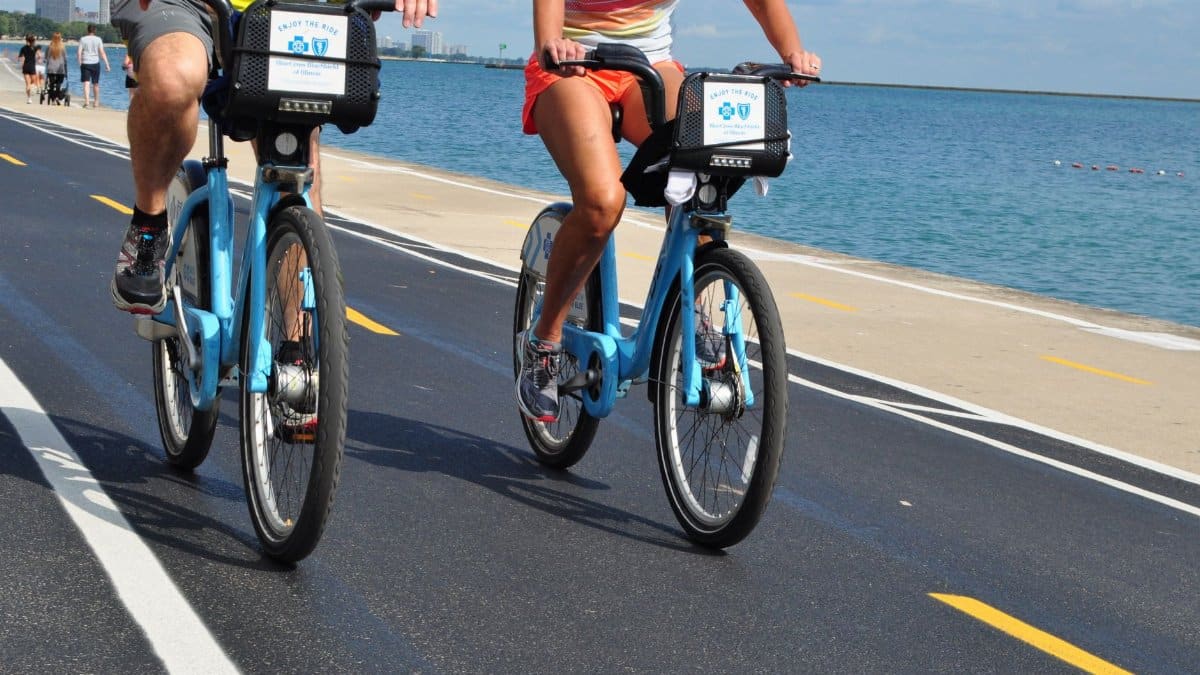 Two cyclists enjoying a ride along Lake Michigan's scenic bike path in Chicago.