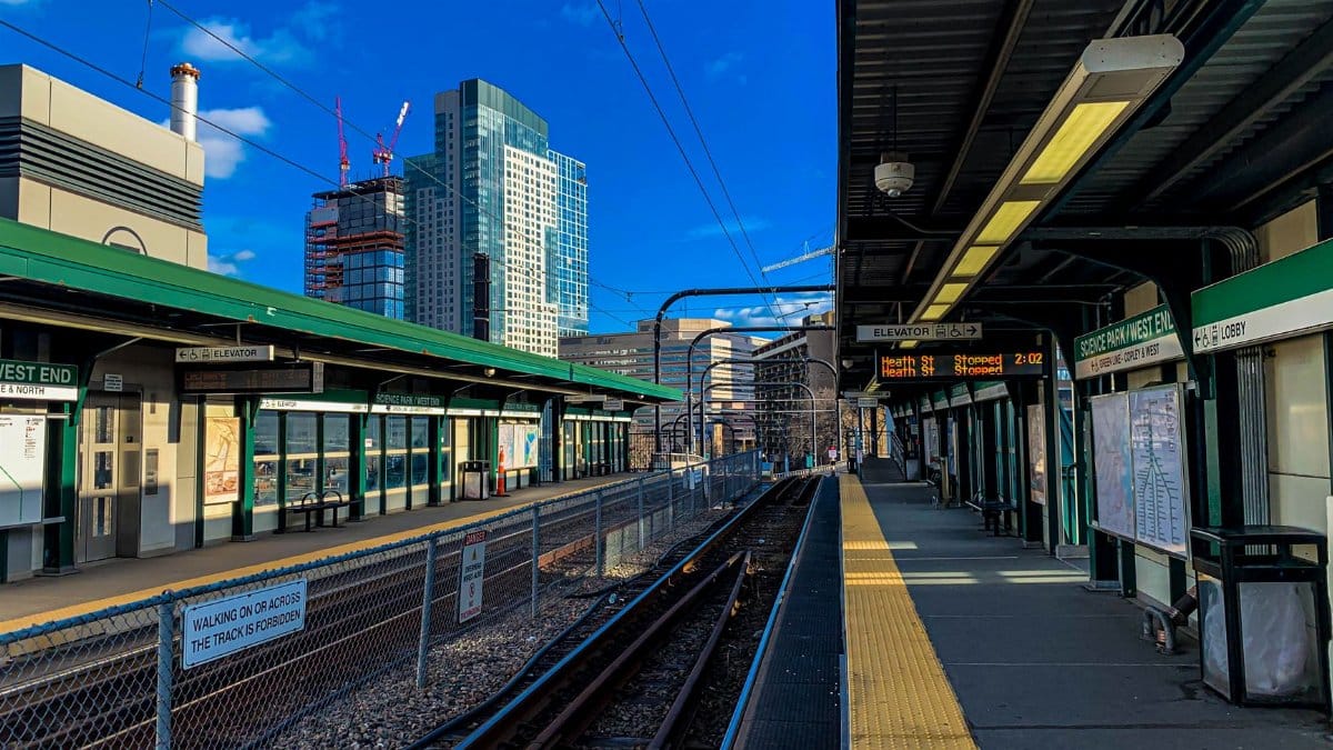 Captured at Boston's train station, showcasing the urban landscape and clear blue sky.