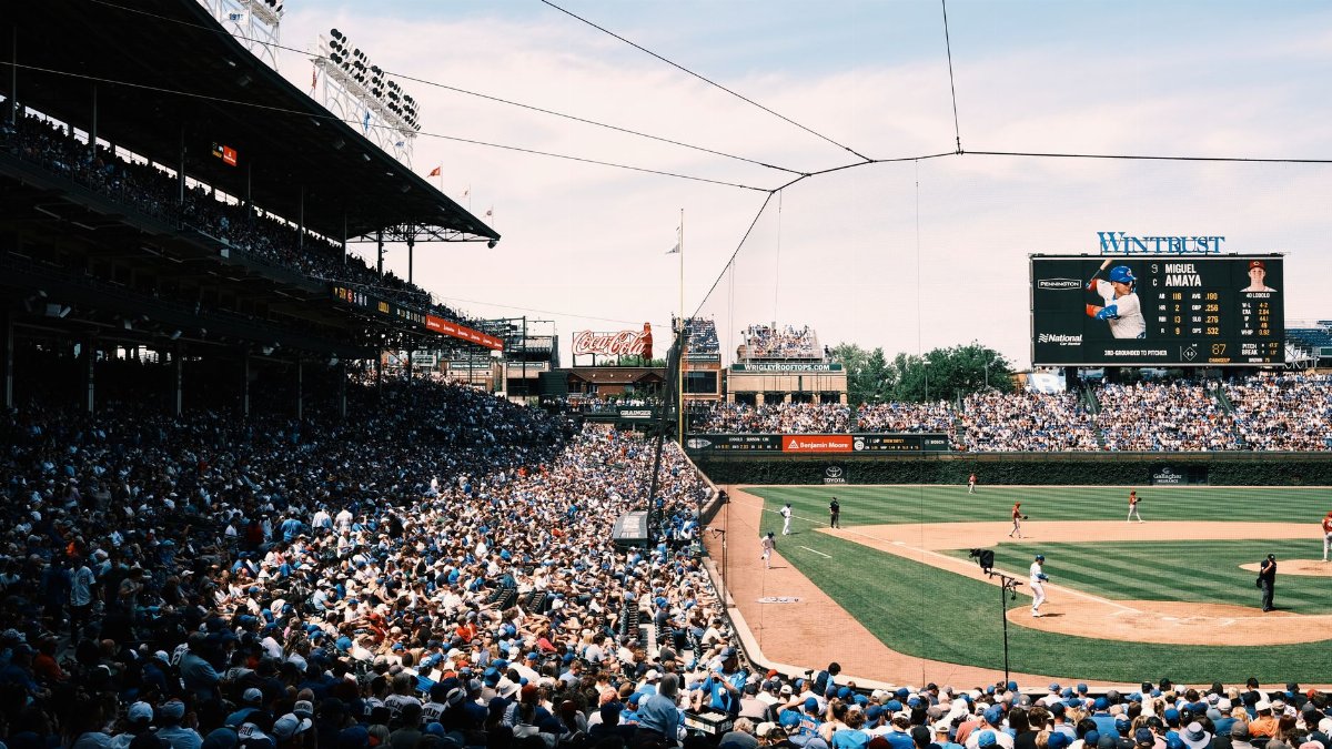 Panoramic view of a bustling baseball game at Wrigley Field, Chicago, capturing the vibrant atmosphere.
