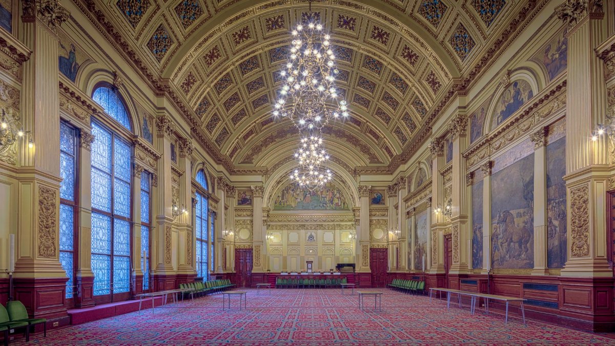 Elegant and historic banquet hall interior at Glasgow City Chambers, Scotland.