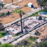 Aerial shot showing a destroyed house by wildfire in Altadena, California, highlighting the devastation.