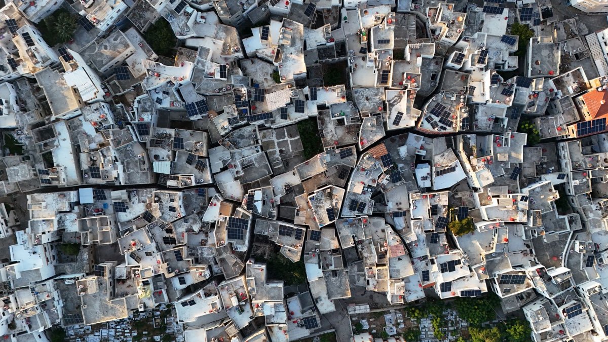 Stunning aerial perspective of densely packed rooftops in Tartus, Syria, showcasing urban residential architecture.