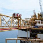 A detailed view of an offshore oil rig in Indonesian waters, highlighting industrial engineering.