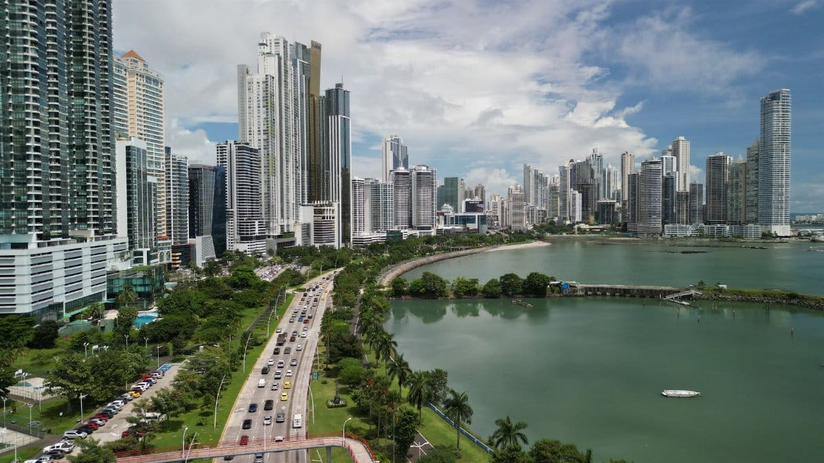 Stunning aerial shot of Panama City's skyline with coastal views and busy streets.