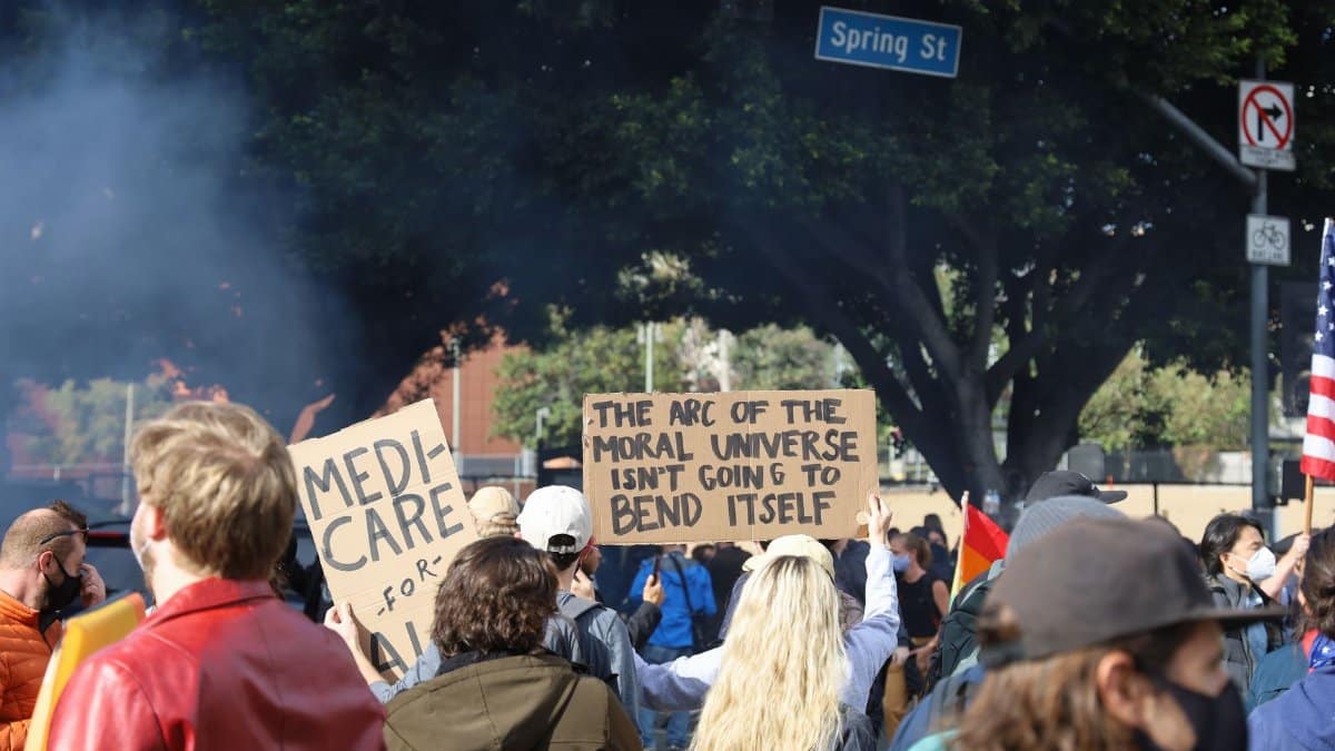 Protesters gather on Los Angeles Spring Street, advocating for social change.
