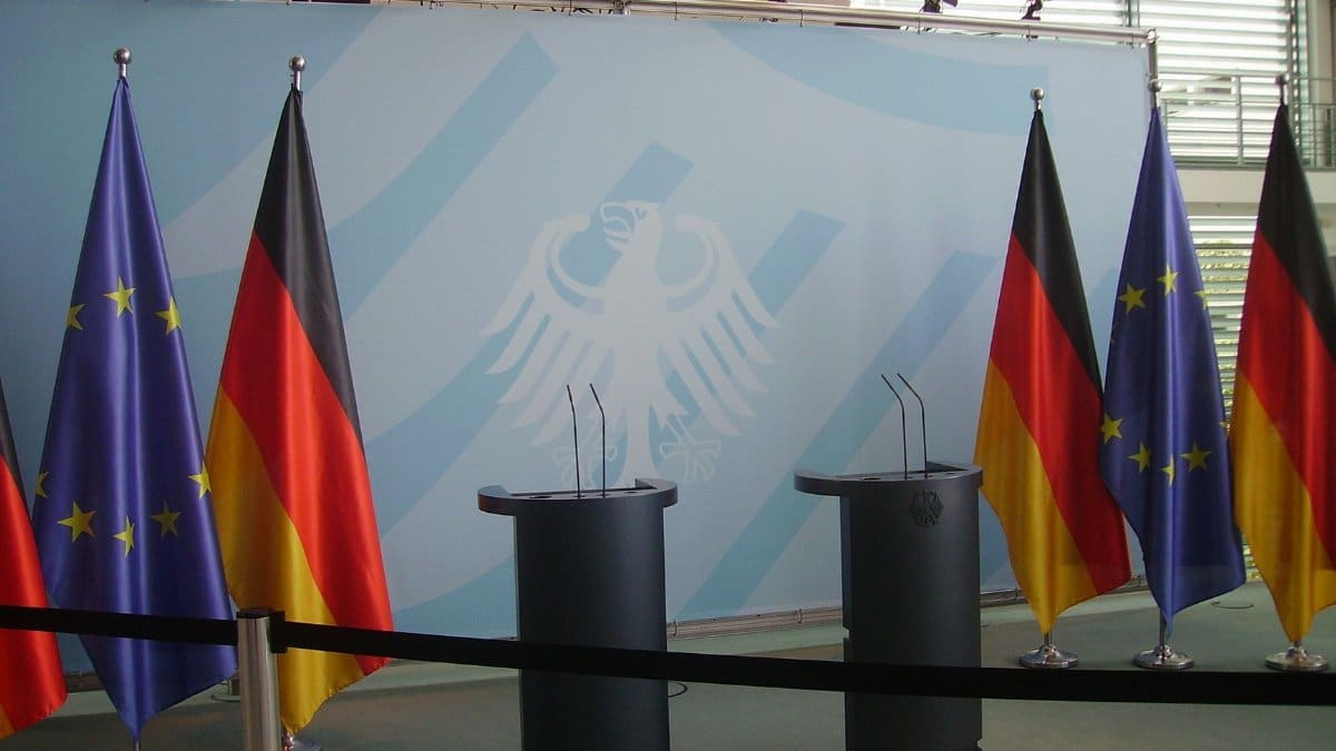 Empty podiums with German and EU flags in Federal Chancellery, Berlin.