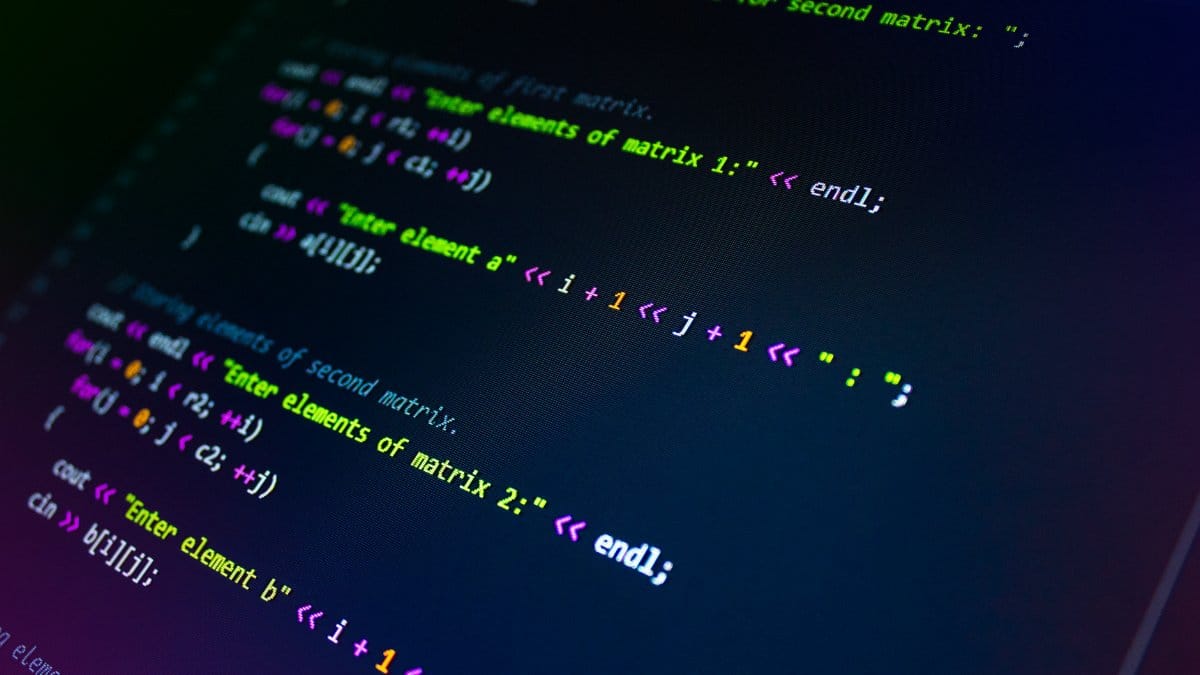 Close-up of colorful programming code displayed on a monitor screen.