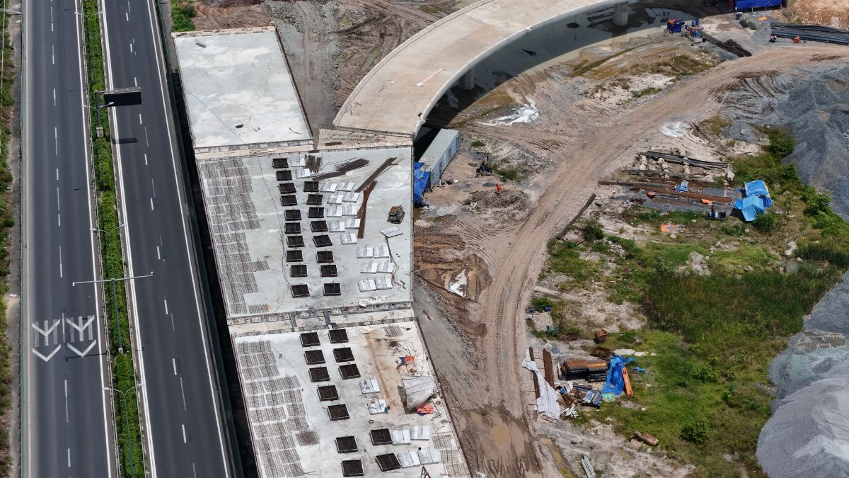 Aerial photograph of a highway under construction near Ho Chi Minh City, showcasing infrastructure development.
