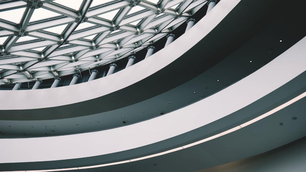 Explore this modern architecture featuring futuristic design and geometric patterns indoors.
