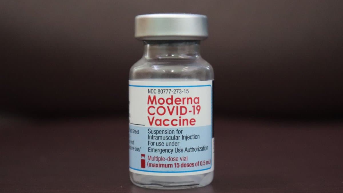 Detailed view of a Moderna COVID-19 vaccine vial, highlighting immunization efforts.