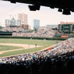 A lively baseball game at Wrigley Field with a packed crowd in Chicago, Illinois.