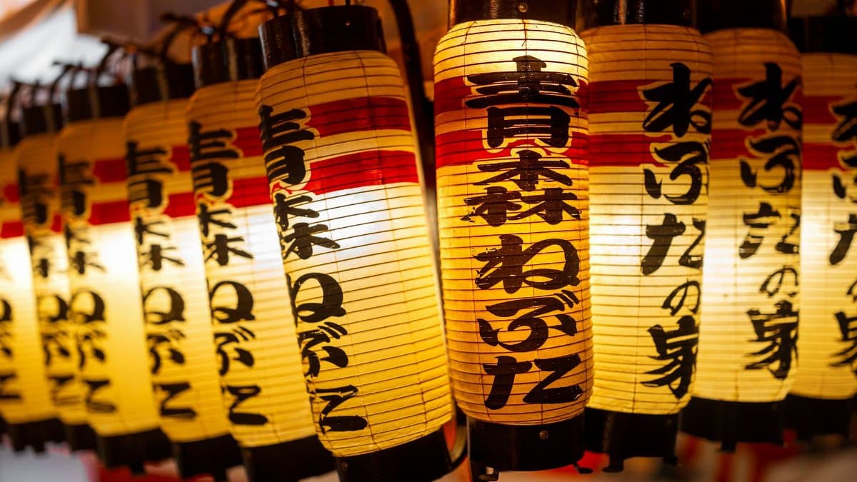 Close-up of illuminated paper lanterns at the Nebuta Festival in Aomori, Japan, showcasing Japanese cultural art.