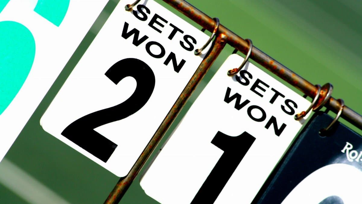 Close-up of a tennis scoreboard showing games won by each player.