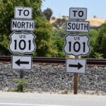 Directional signs for US Route 101 seen in San Miguel, California during a sunny day.