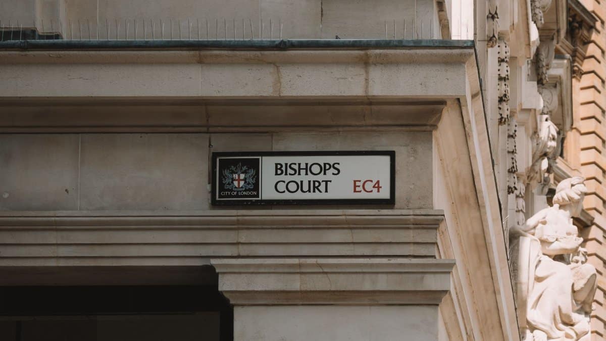 Close-up of Bishops Court sign on classical building in London, United Kingdom.