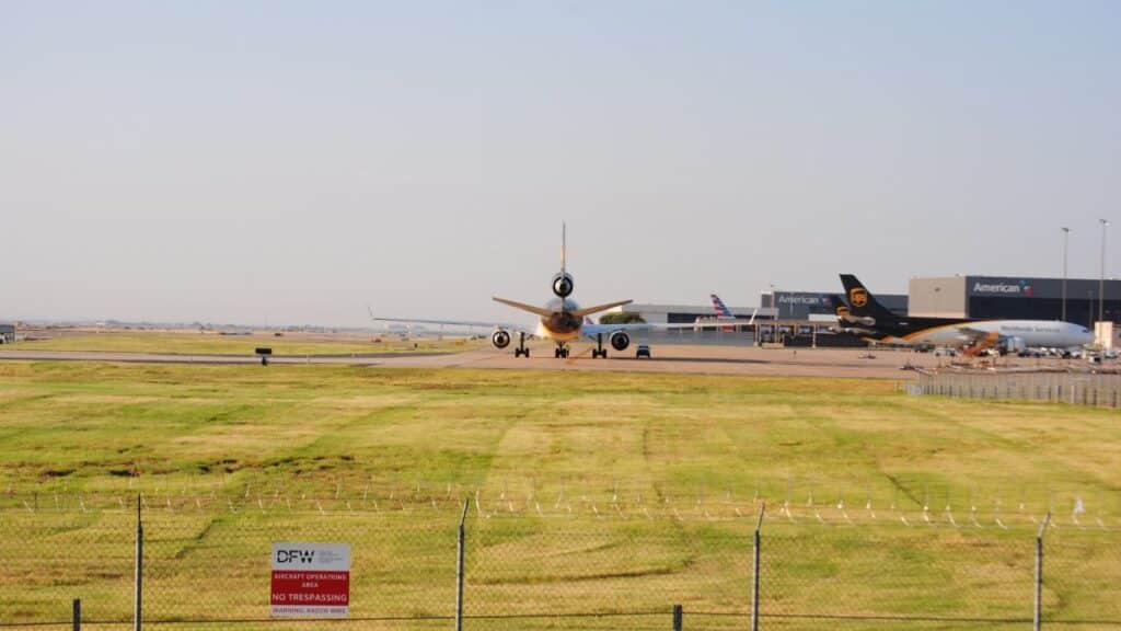 A wide view of planes taxiing at DFW Airport in Grapevine, Texas. Perfect for aviation and travel themes.
