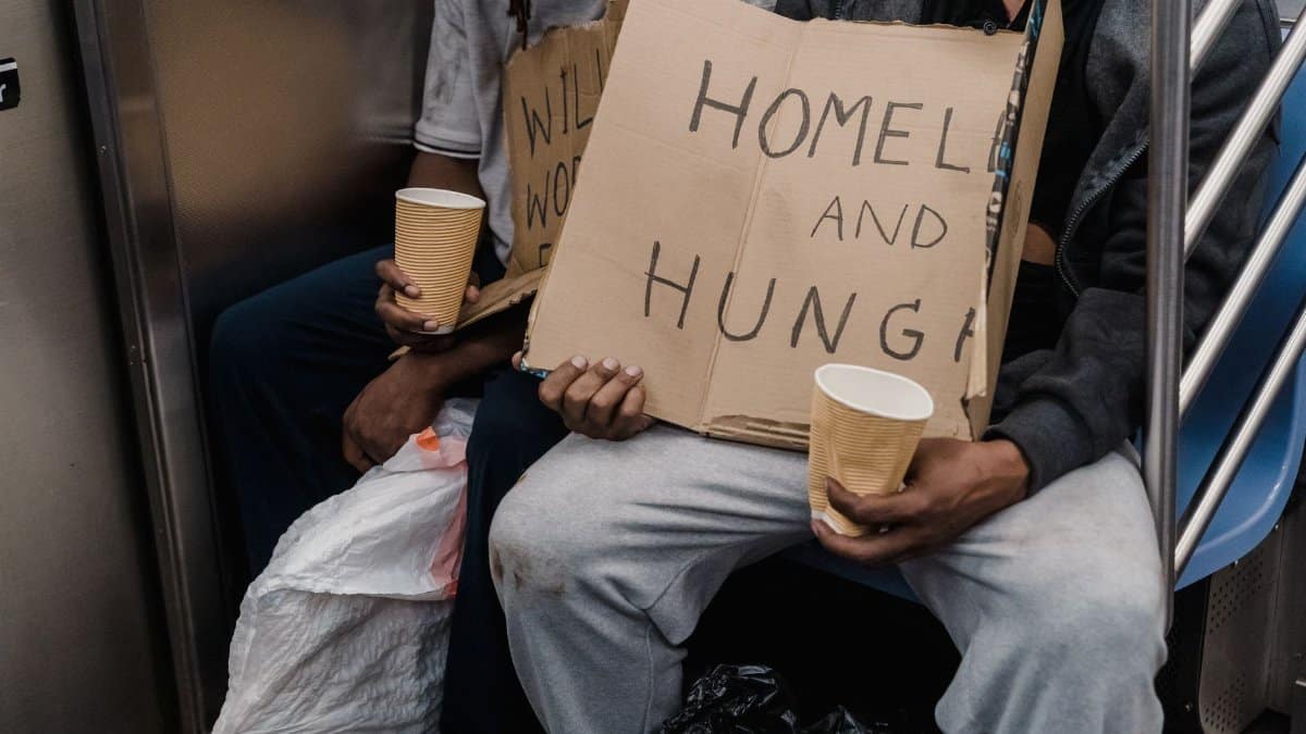 A poignant image capturing the realities of homelessness on public transportation.