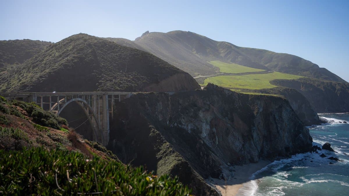 Breathtaking aerial view of Bixby Creek Bridge set against Big Sur's rugged coastline.