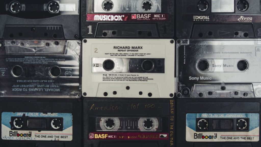 A nostalgic collection of vintage audio cassettes, showcasing iconic music from past decades.