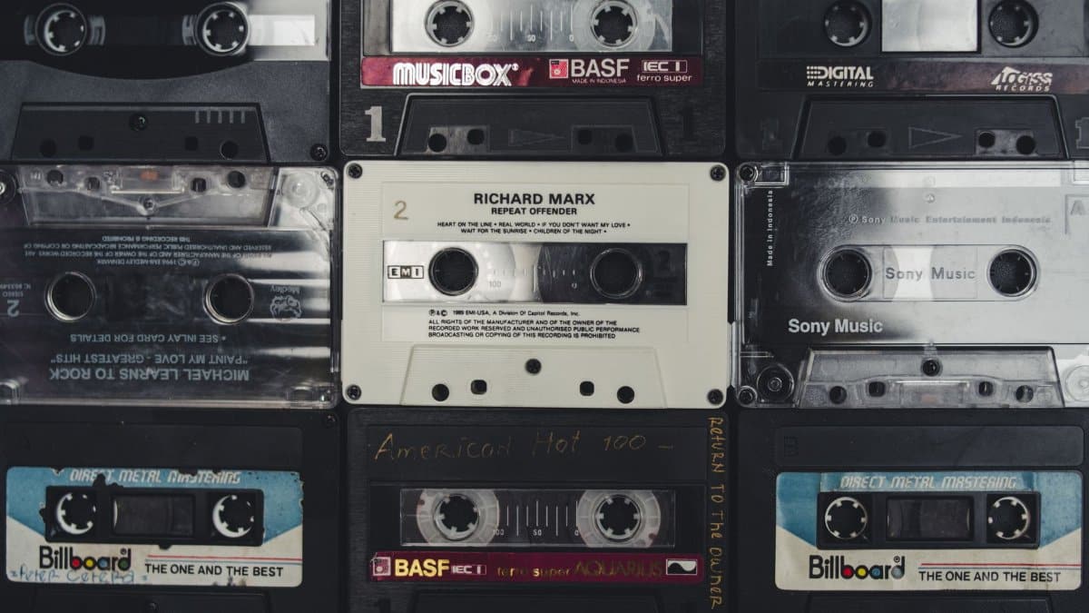 A nostalgic collection of vintage audio cassettes, showcasing iconic music from past decades.