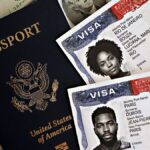 Close-up of a U.S. passport with visas and currency, symbolizing international travel and immigration.
