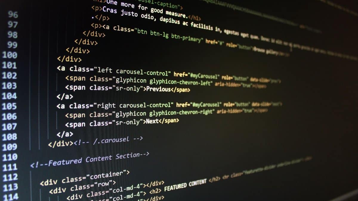 Close-up of HTML code displayed on a computer monitor, showcasing web development.